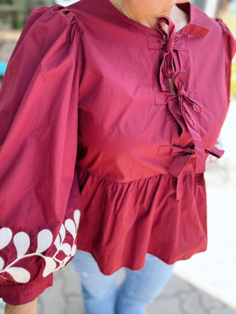 Front Bow Tie Embroidered Peplum Top
