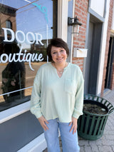 Split Neck Raw Edge Long Sleeve Ribbed Top