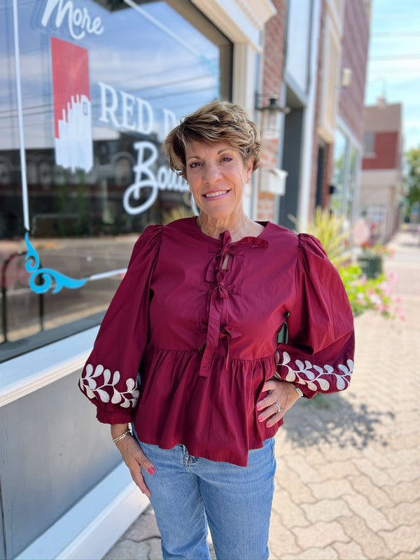 Front Bow Tie Embroidered Peplum Top