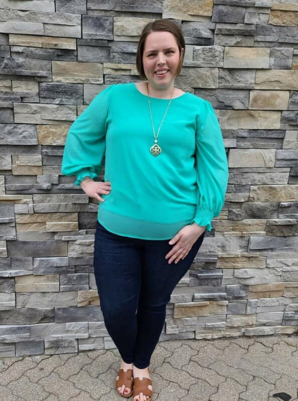 Curvy Green long sleeve top with cinched sleeves