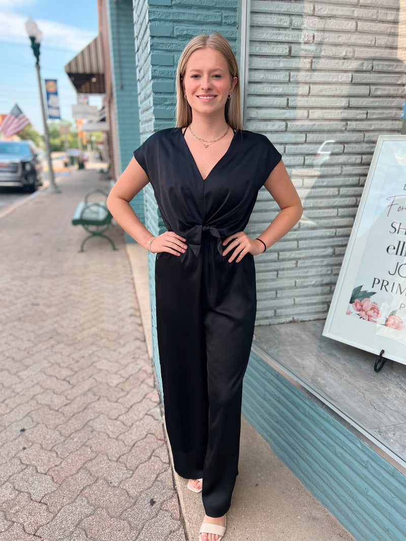 Black silk romper with knot detail