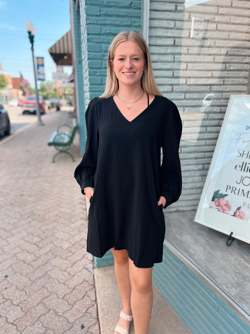 Black v-neck dress with three quarter sleeves