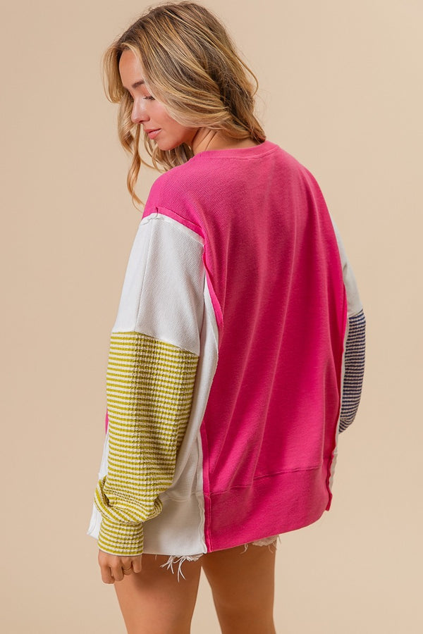 Pink Knit Top with Blue and Green Striped Sleeve