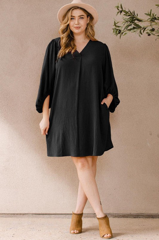 Curvy black v-neck balloon sleeve dress