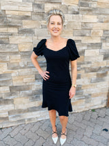 Black knit ruffle hem dress