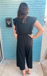 Black surplice ruffle sleeve jumpsuit