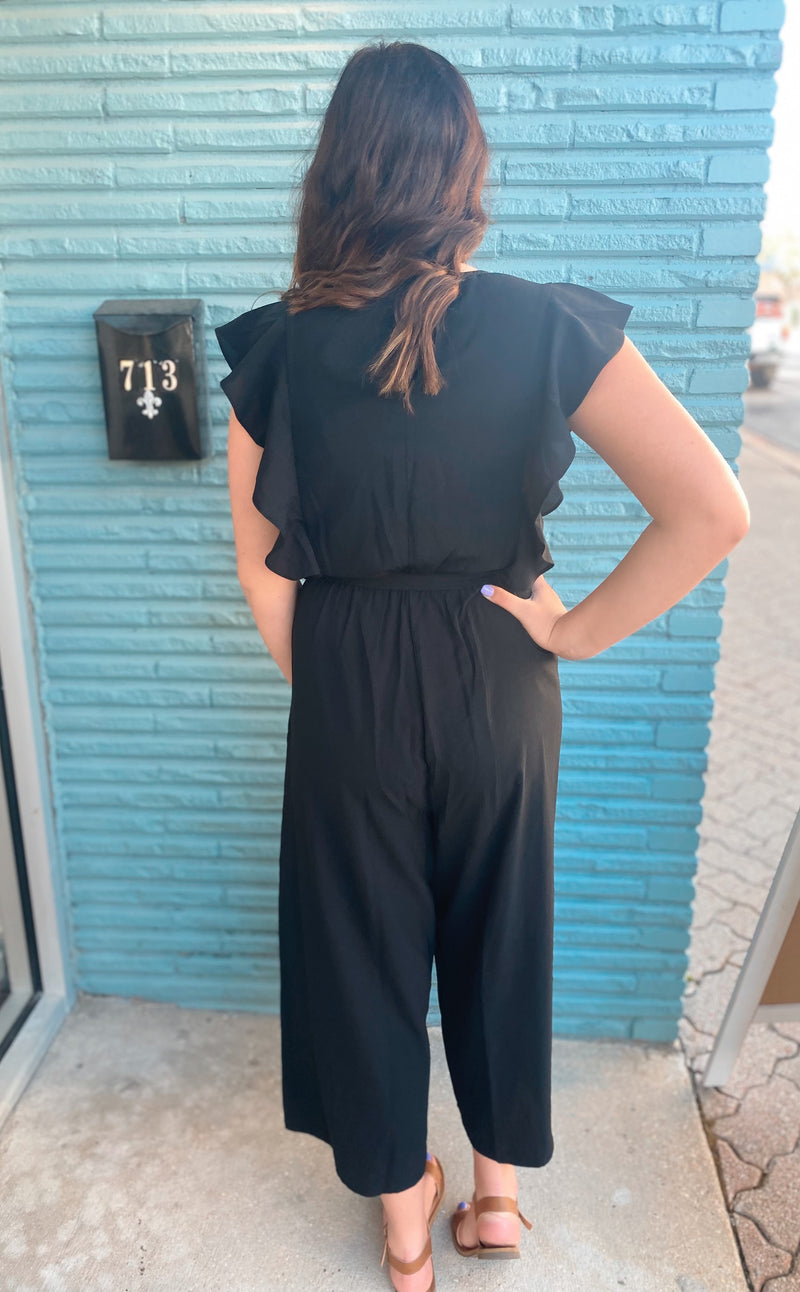 Black surplice ruffle sleeve jumpsuit
